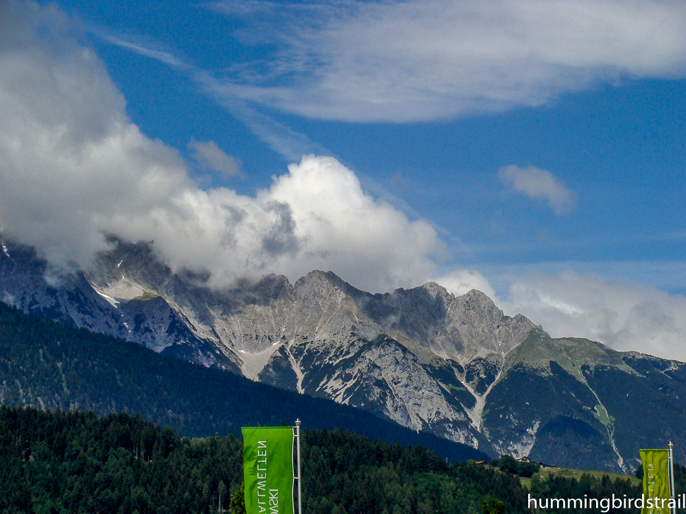 adjoining snow-capped peaks