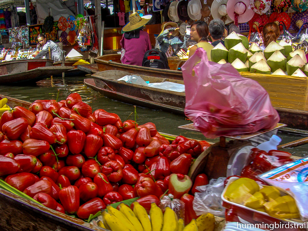 Fresh vegetables and coconuts on sampan(s)