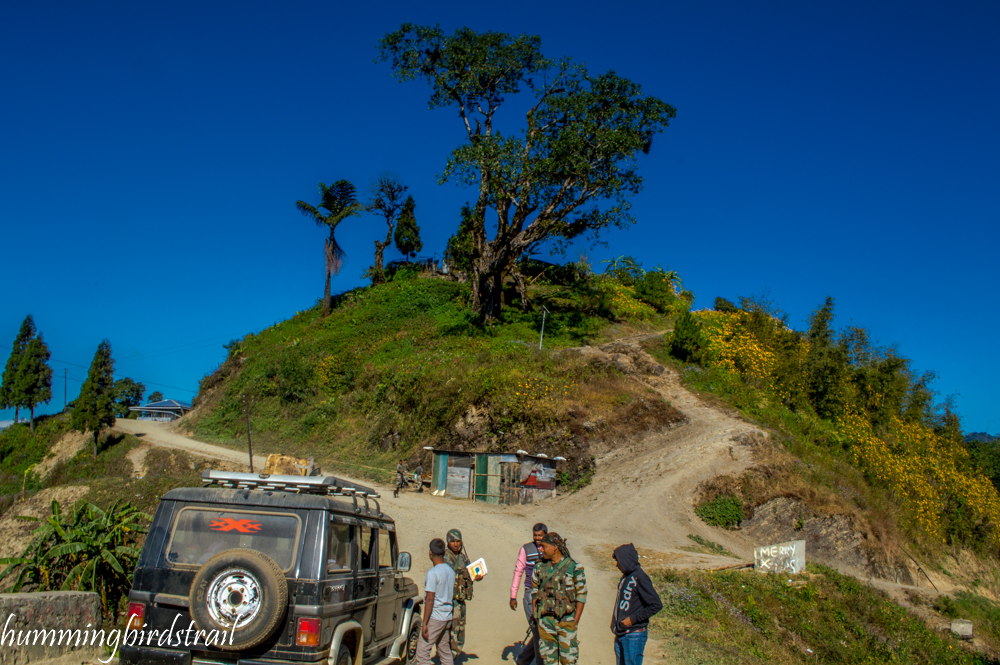 Right goes to Myanmar and left goes to India, King lives top of the hill in front and India army check-post at the junction